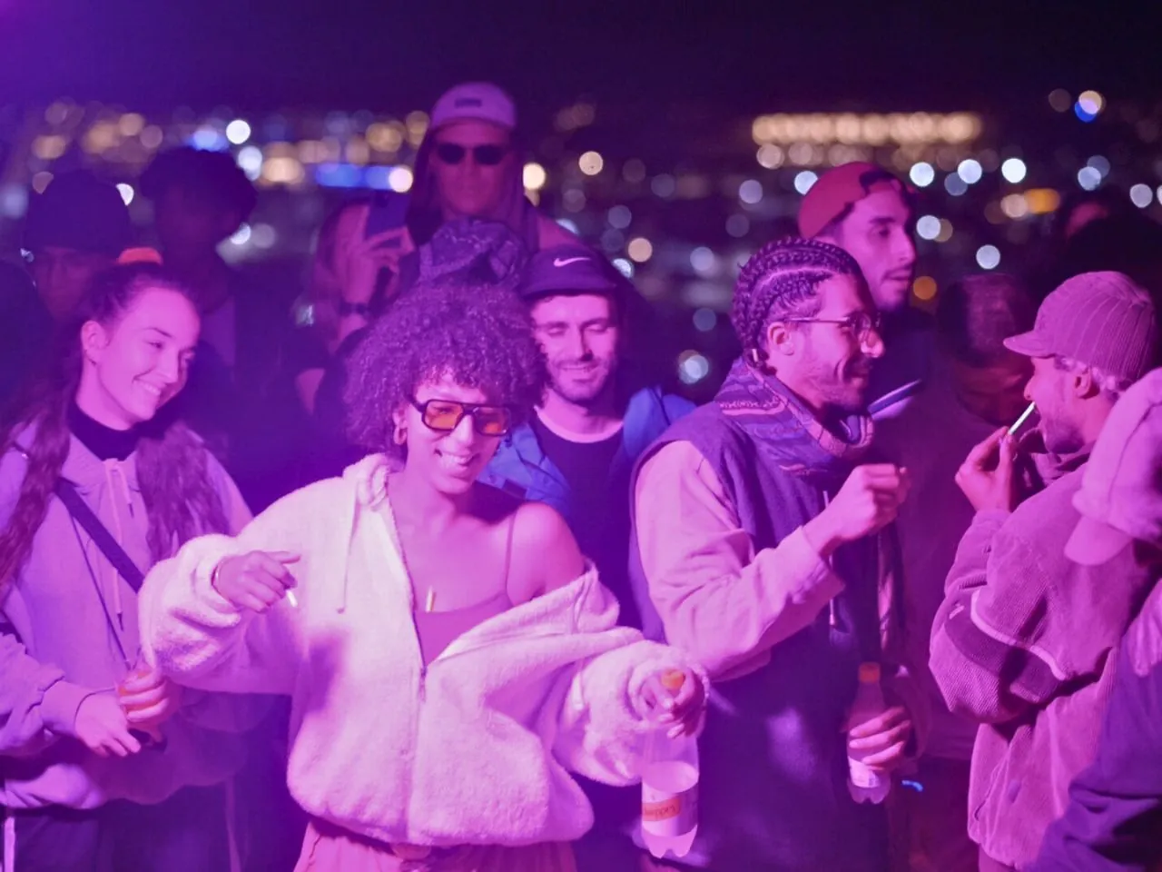 Guests dancing under purple light